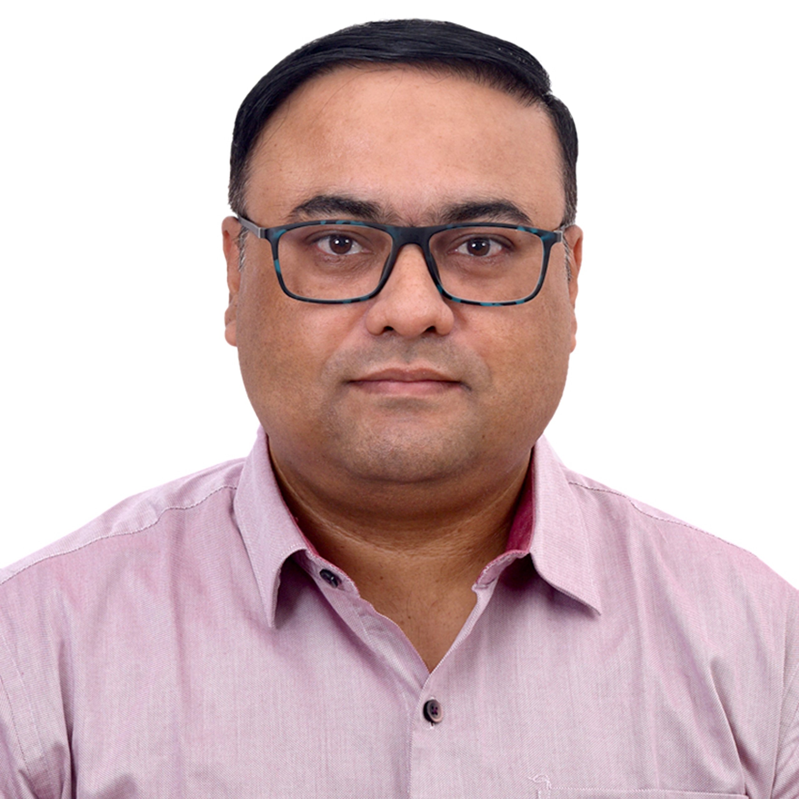 Portrait of a man in a pink shirt and glasses.